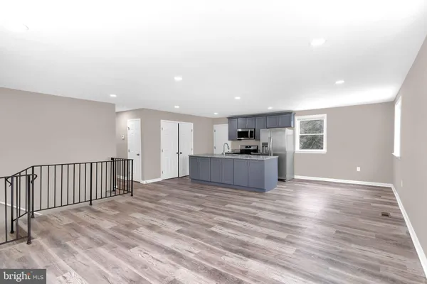 a view of kitchen and wooden floor