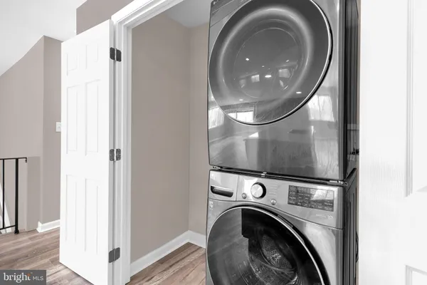 a view of a hallway with washer and dryer