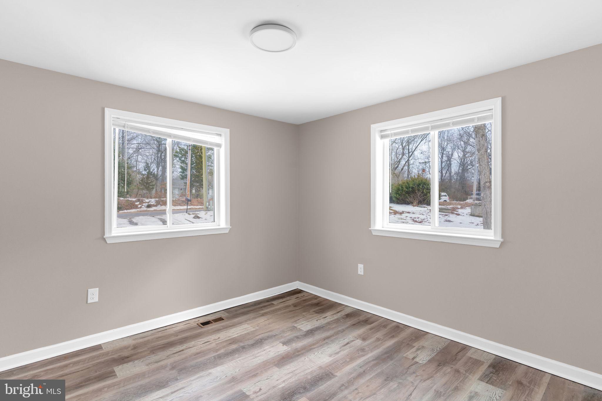 383 Sollers Wharf Road, Unit A Lusby, MD 20657 - Photo 8 of 16 a view of empty room with window