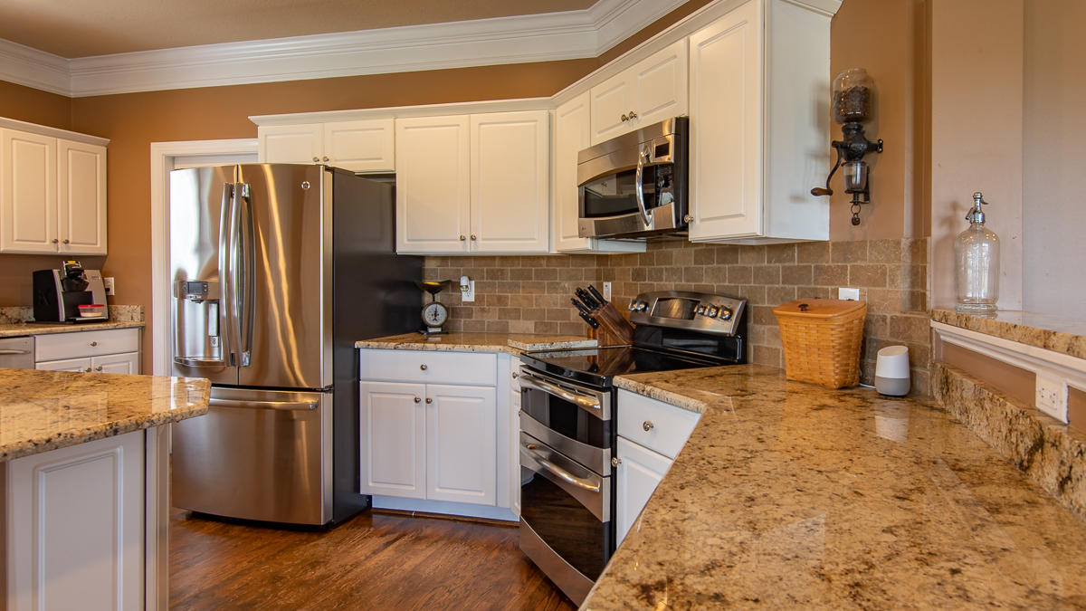 5738 North Fork Road Elliston, VA 24087 - Photo 19 of 77 a kitchen with a refrigerator stove and sink