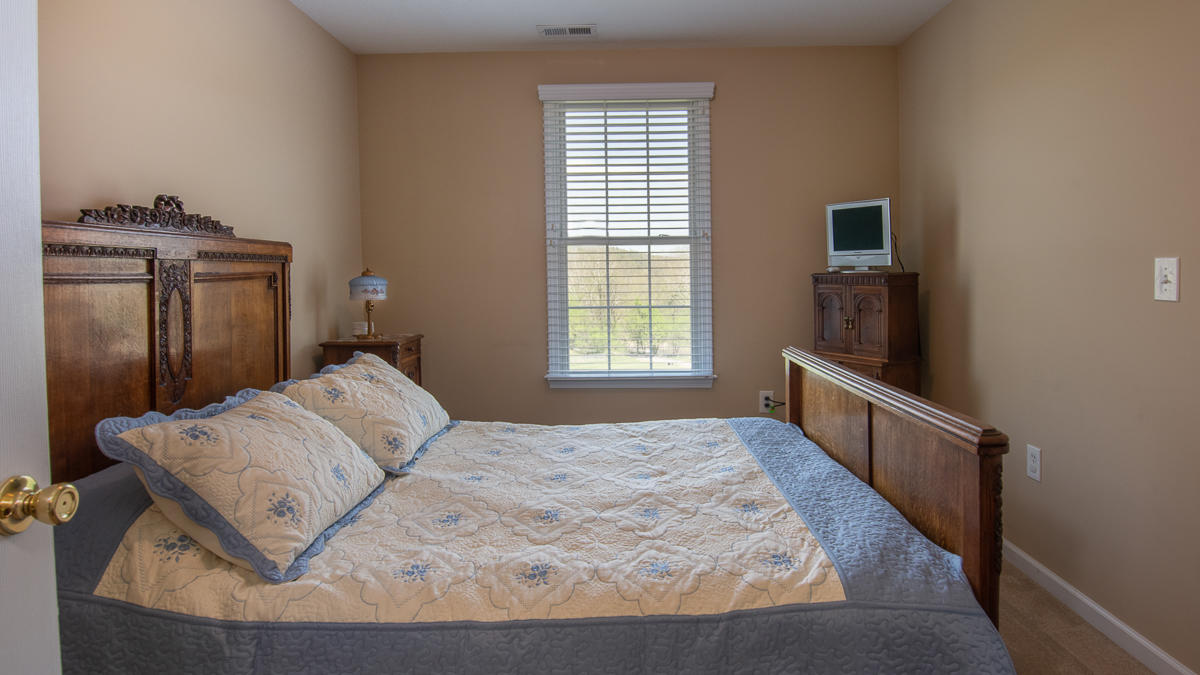 5738 North Fork Road Elliston, VA 24087 - Photo 38 of 77 a bedroom with a bed and wooden floor