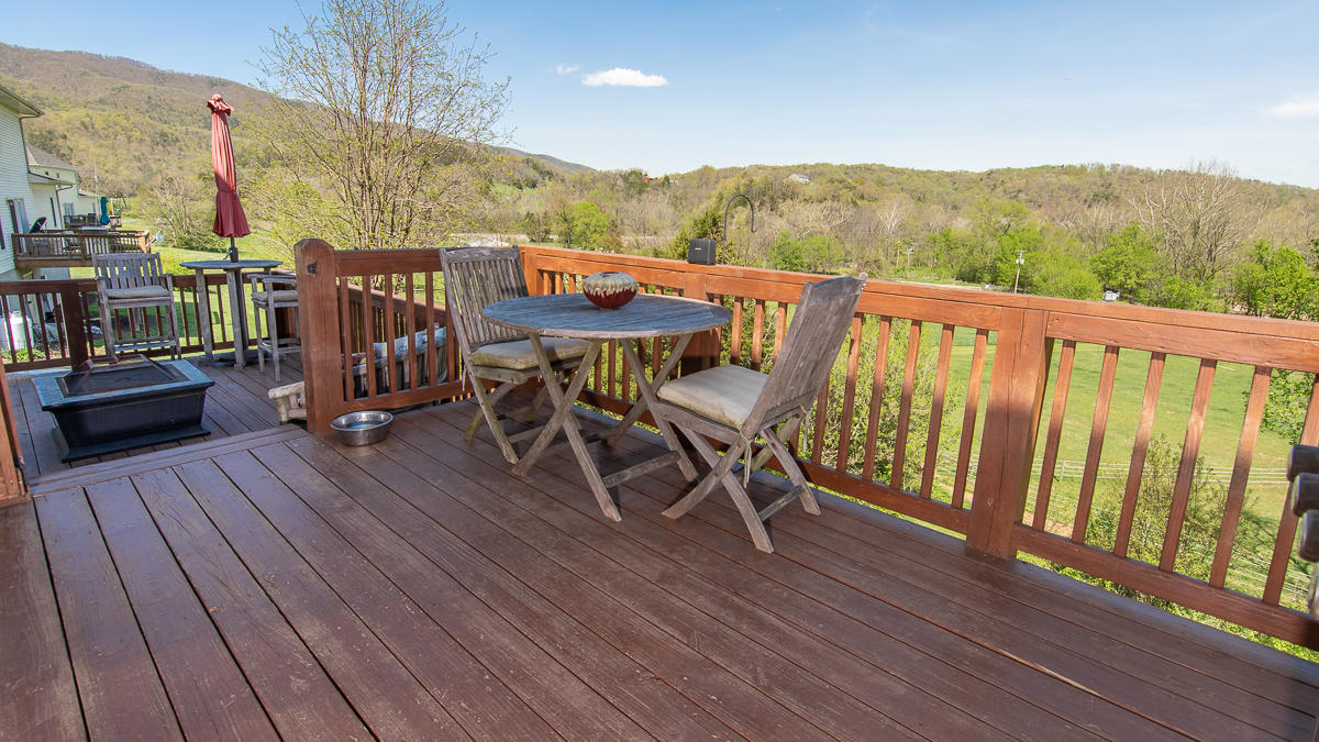 5738 North Fork Road Elliston, VA 24087 - Photo 51 of 77 a view of balcony with furniture and wooden floor