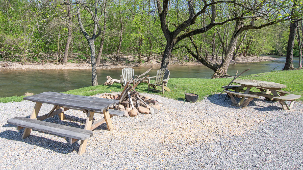 5738 North Fork Road Elliston, VA 24087 - Photo 69 of 77 a wooden bench sitting in the middle of a park with large trees