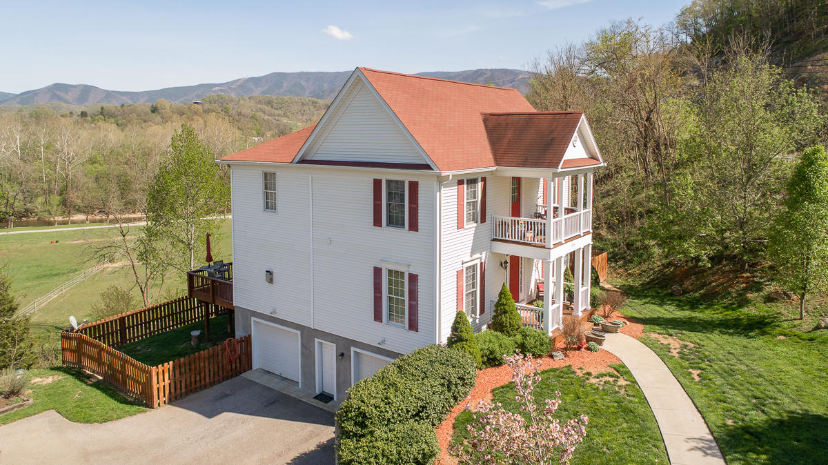 5738 North Fork Road Elliston, VA 24087 - Photo 77 of 77 an aerial view of a house with a yard