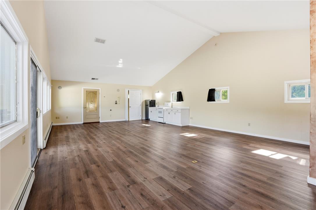 6271 Batman Road Zionsville, PA 18092 - Photo 79 of 100 Vast open-concept space features vaulted ceilings and rich wood flooring.