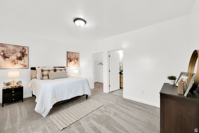 8215 Clear Rock Road, Unit 12 Eagle Mountain, UT 84005 - Photo 2 of 38 Spacious room featuring light gray carpet flooring and white painted walls
