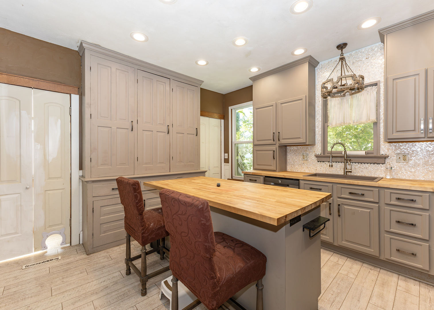 112 South State Street Atkinson, IL 61235 - Photo 12 of 24 a kitchen with a table chairs sink and cabinets