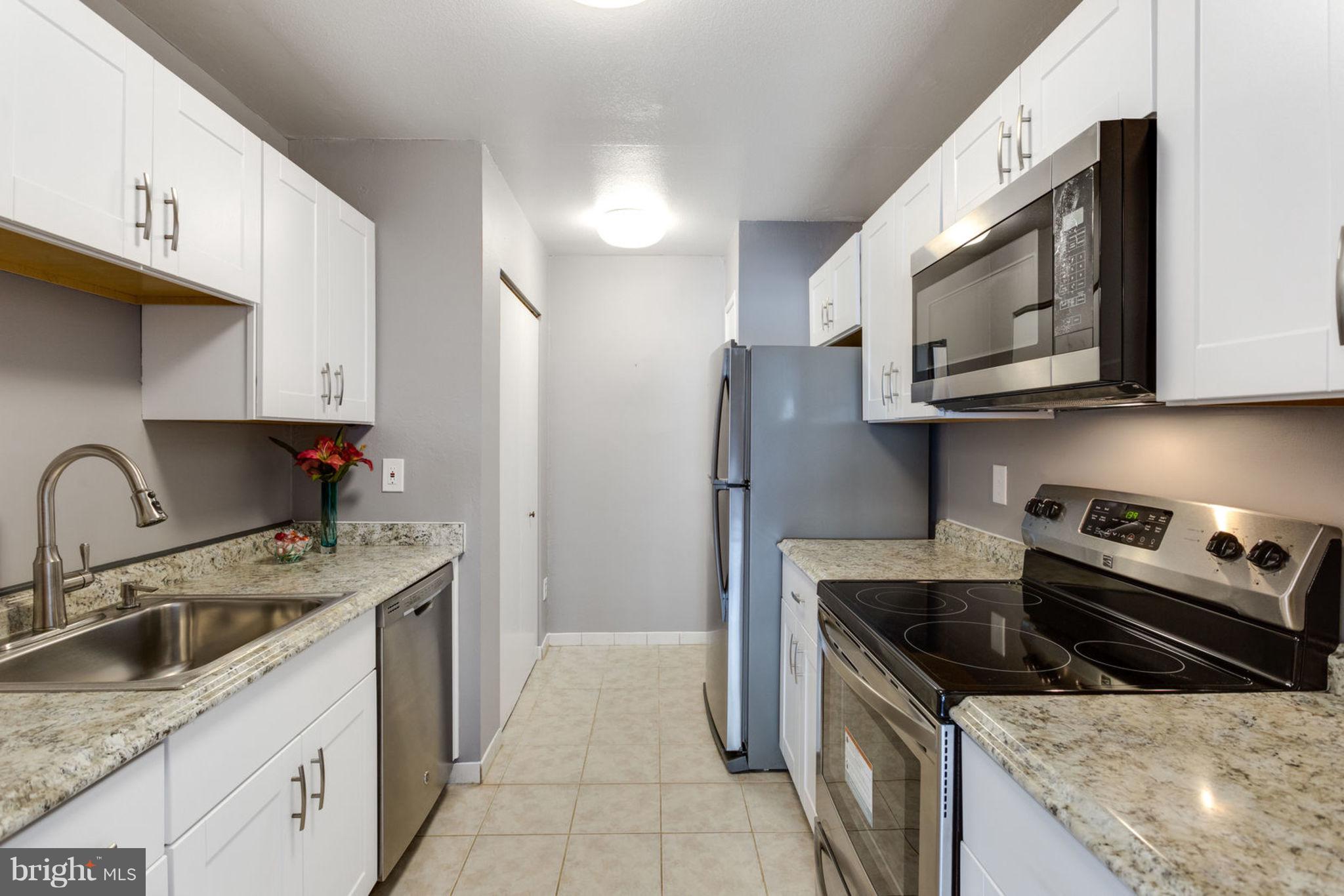 6101 Edsall Road, Unit 1105 Alexandria, VA 22304 - Photo 10 of 42 MODERNIZED GALLEY KITCHEN