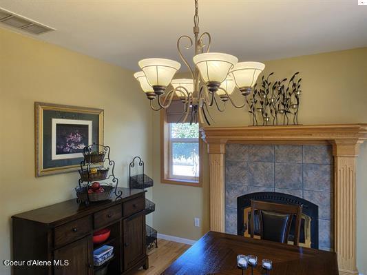 1599 Samuels Road Sandpoint, ID 83864 - Photo 10 of 56 Dining room with fireplace