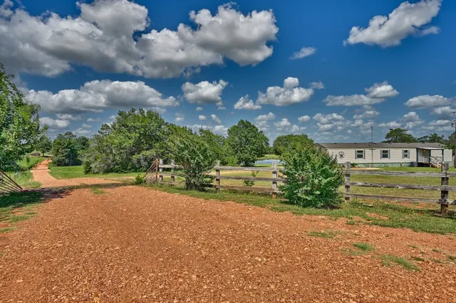 a view of a house with a big yard