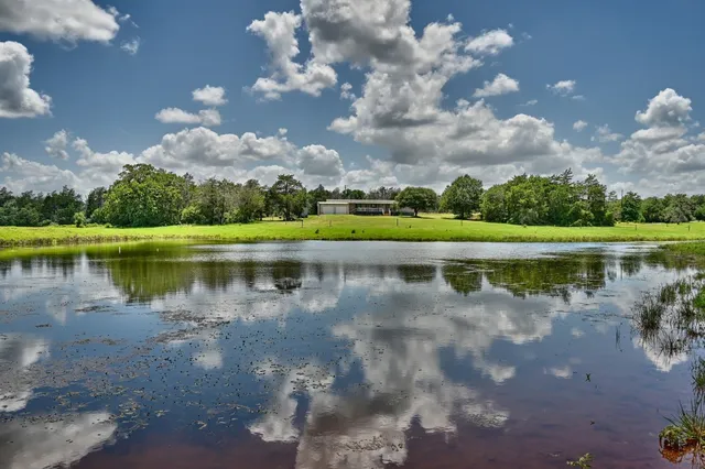 a view of a lake with a big yard