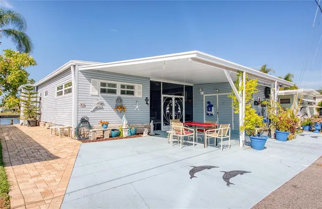 a view of the patio with dining table and chairs