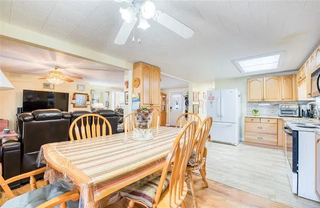 a view of a dining room with furniture and window