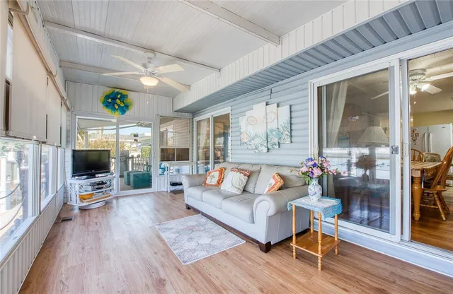a living room with fireplace furniture and a flat screen tv