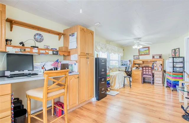 a view of a living room and kitchen