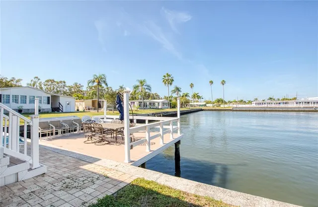 a view of a swimming pool with seating area