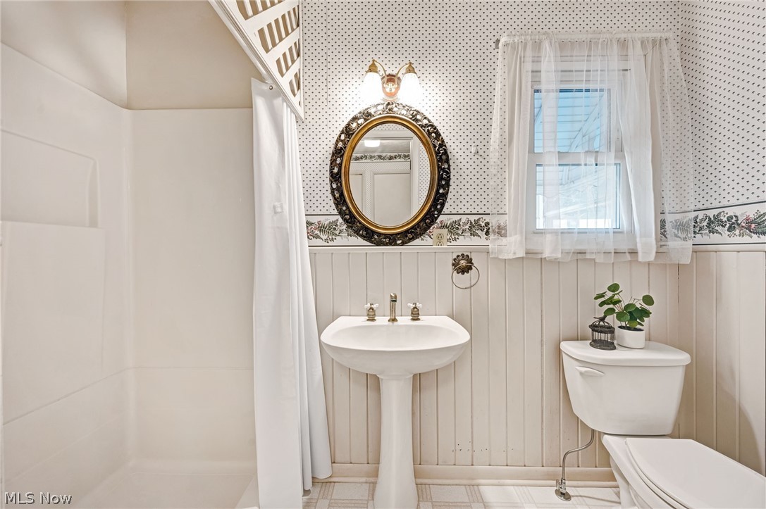 6452 Carsten Road Medina, OH 44256 - Photo 14 of 41 Bathroom with sink, tile floors, and toilet
