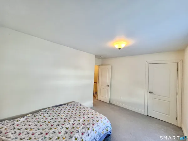 a bedroom with a bed and a cabinets