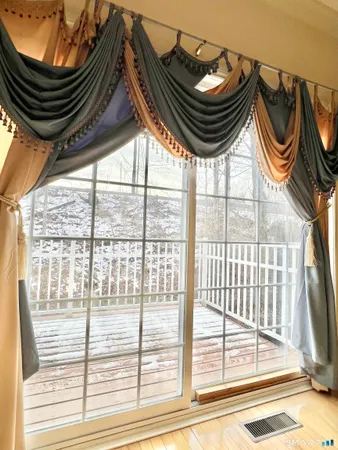 a bathroom with a sink a mirror and a window