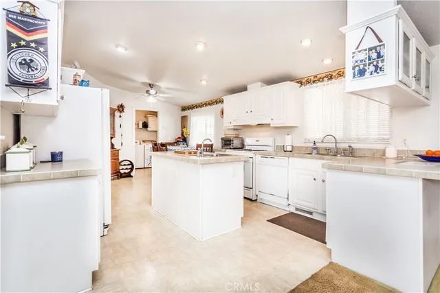 a kitchen with cabinets and window