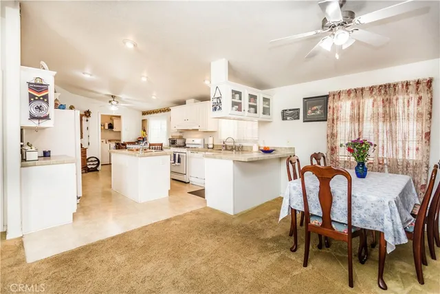 a living room with kitchen island furniture and a kitchen view