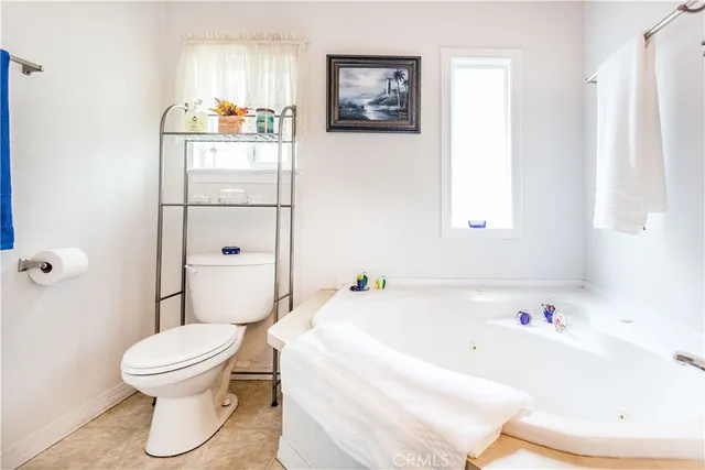 a bathroom with a bathtub and a toilet