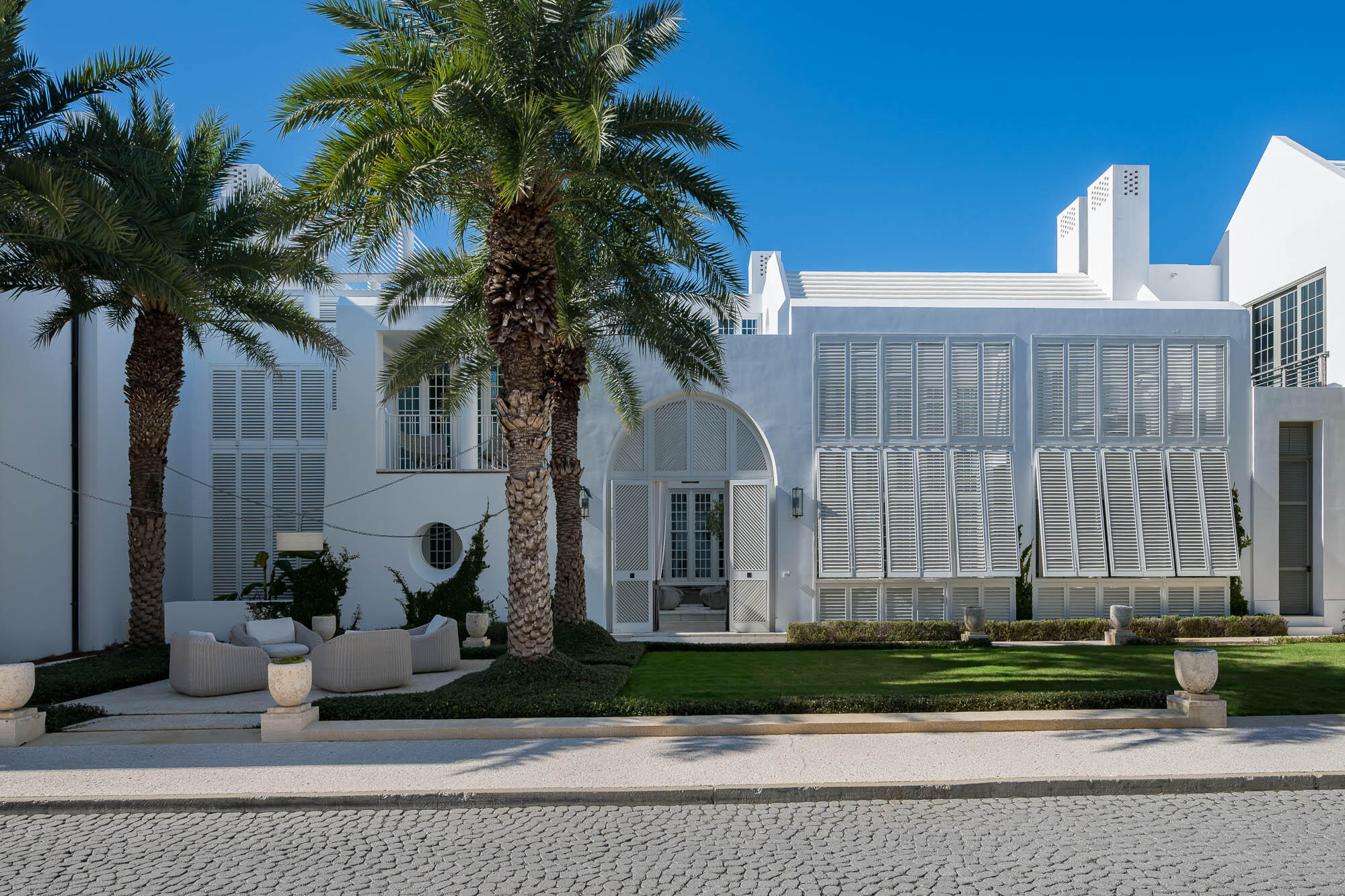 a front view of a house with garden
