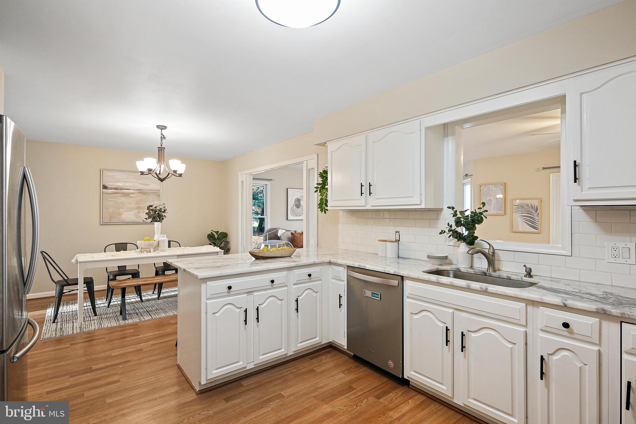 18819 Brick Store Road Hampstead, MD 21074 - Photo 5 of 33 Kitchen w/ Breakfast Bar & Pass Thru to Family Rm
