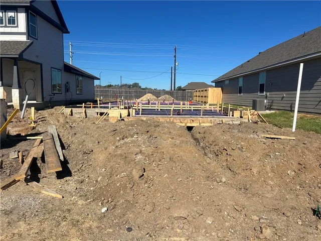 a view of a yard with car parked