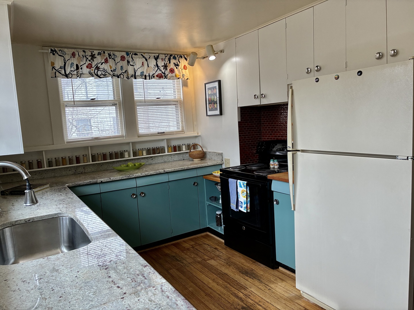 1009 West Church Street Champaign, IL 61821 - Photo 11 of 40 a kitchen with a refrigerator and a sink