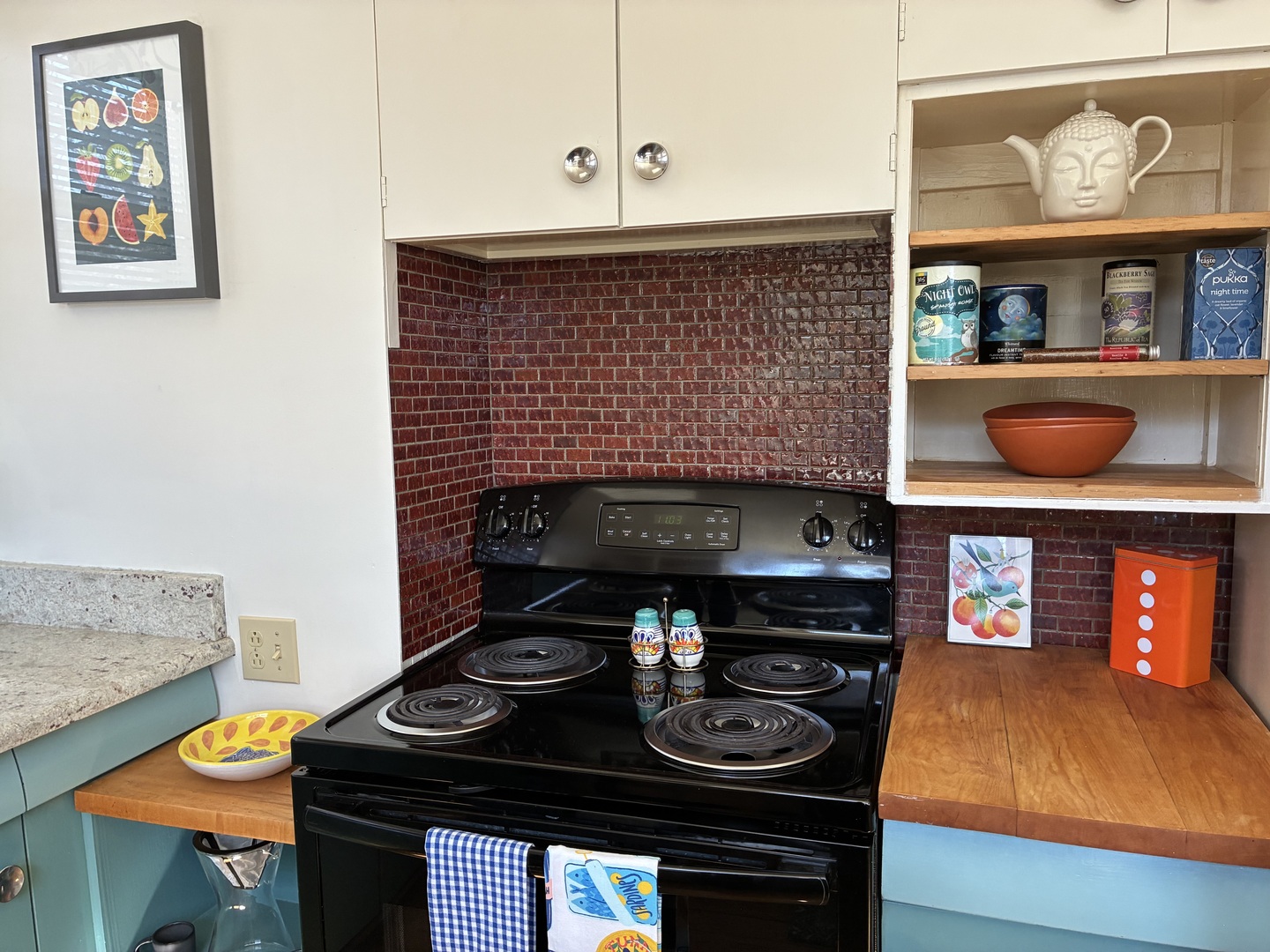 1009 West Church Street Champaign, IL 61821 - Photo 12 of 40 a stove top oven sitting inside of a kitchen