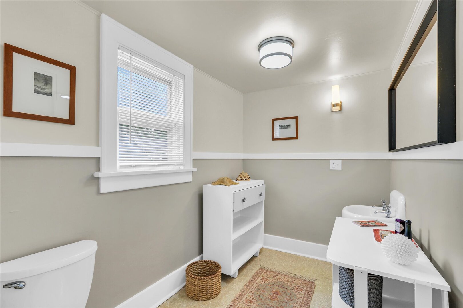 1009 West Church Street Champaign, IL 61821 - Photo 16 of 40 a bathroom with a sink toilet and a mirror