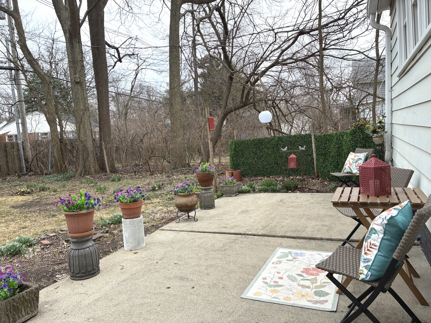 1009 West Church Street Champaign, IL 61821 - Photo 34 of 40 a view of a patio with table and chairs and potted plants