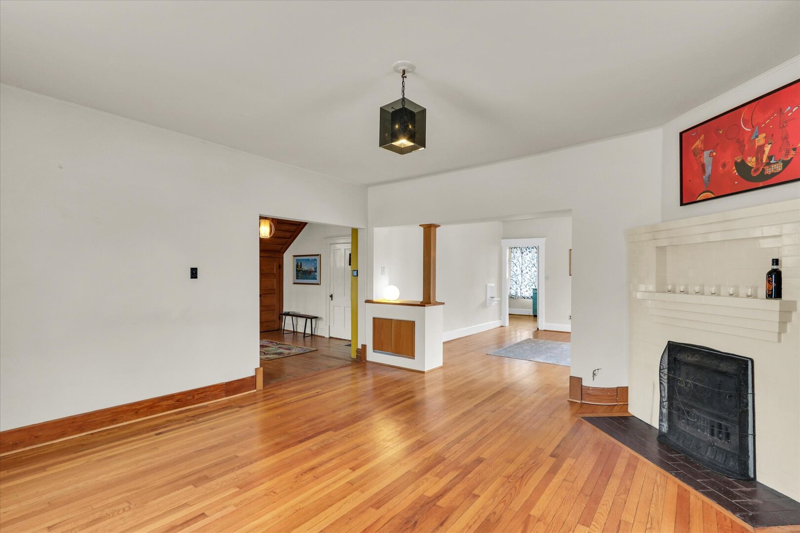 1009 West Church Street Champaign, IL 61821 - Photo 6 of 40 a view of a livingroom with wooden floor and a fireplace