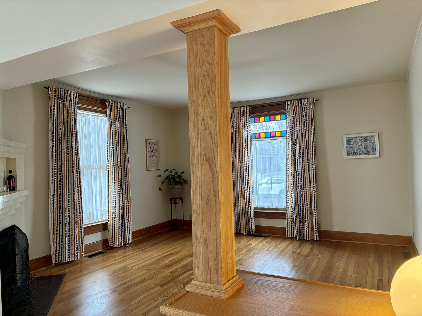 1009 West Church Street Champaign, IL 61821 - Photo 7 of 40 an empty room with wooden floor and windows