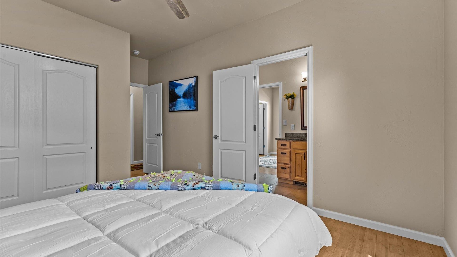 1712 Powis Lane Fruita, CO 81521 - Photo 25 of 39 a bedroom with a bed and a table