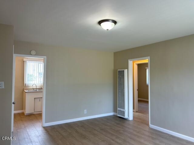714 West 5th Street, Unit 714D Oxnard, CA 93030 - Photo 2 of 7 an empty room with wooden floor and closet