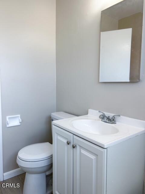 714 West 5th Street, Unit 714D Oxnard, CA 93030 - Photo 5 of 7 a bathroom with a sink a toilet and mirror