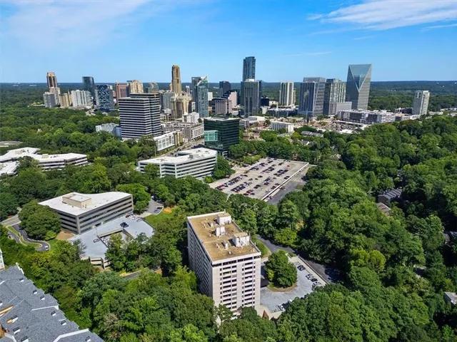a aerial view of a city with tall buildings