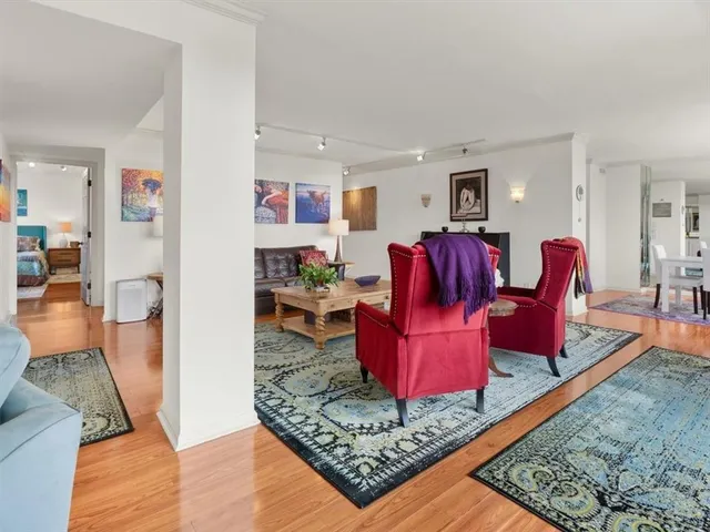 a living room with furniture and a rug