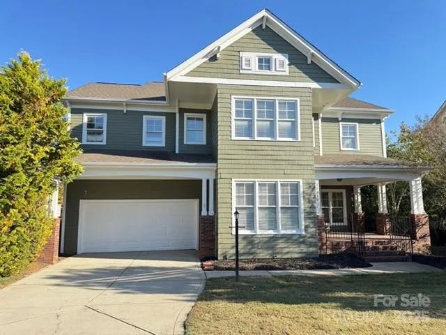 a front view of a house with a garage