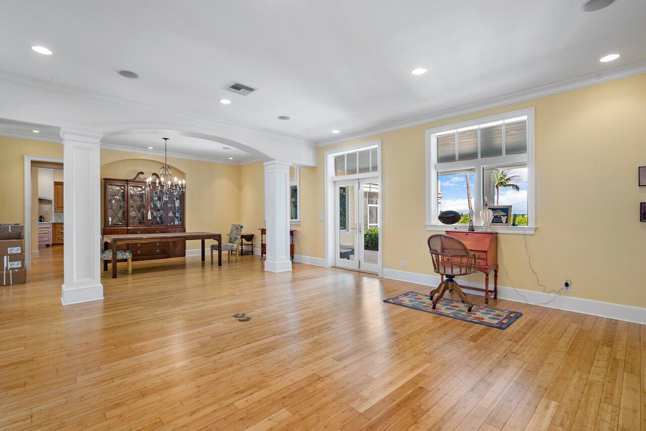 5559 Pennock Point Road Jupiter, FL 33458 - Photo 30 of 72 a living room with furniture and a wooden floor