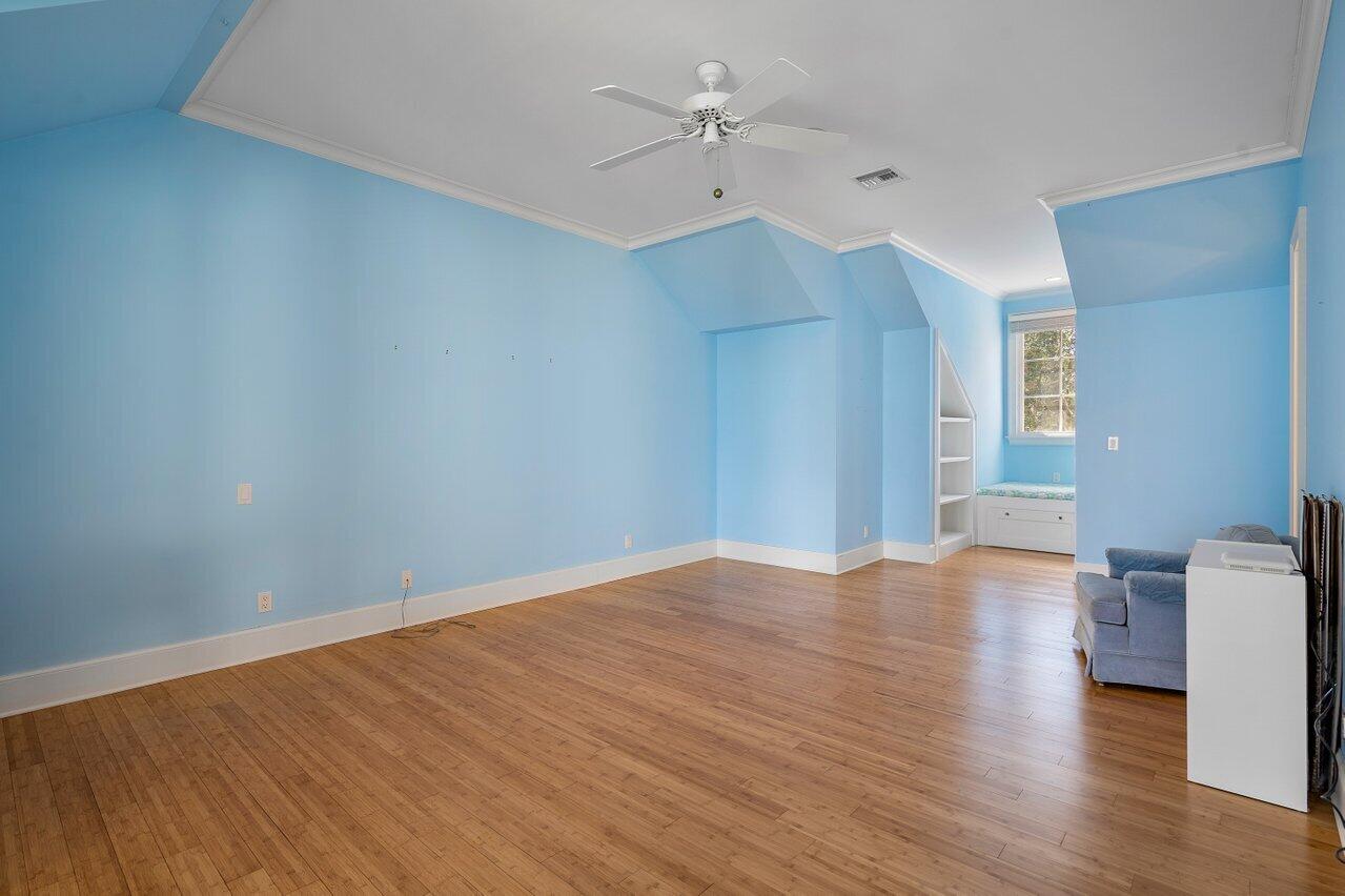 5559 Pennock Point Road Jupiter, FL 33458 - Photo 35 of 72 wooden floor in an empty room with a window