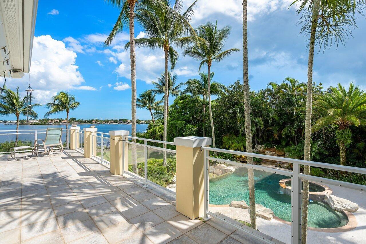 5559 Pennock Point Road Jupiter, FL 33458 - Photo 39 of 72 a view of a house with a yard