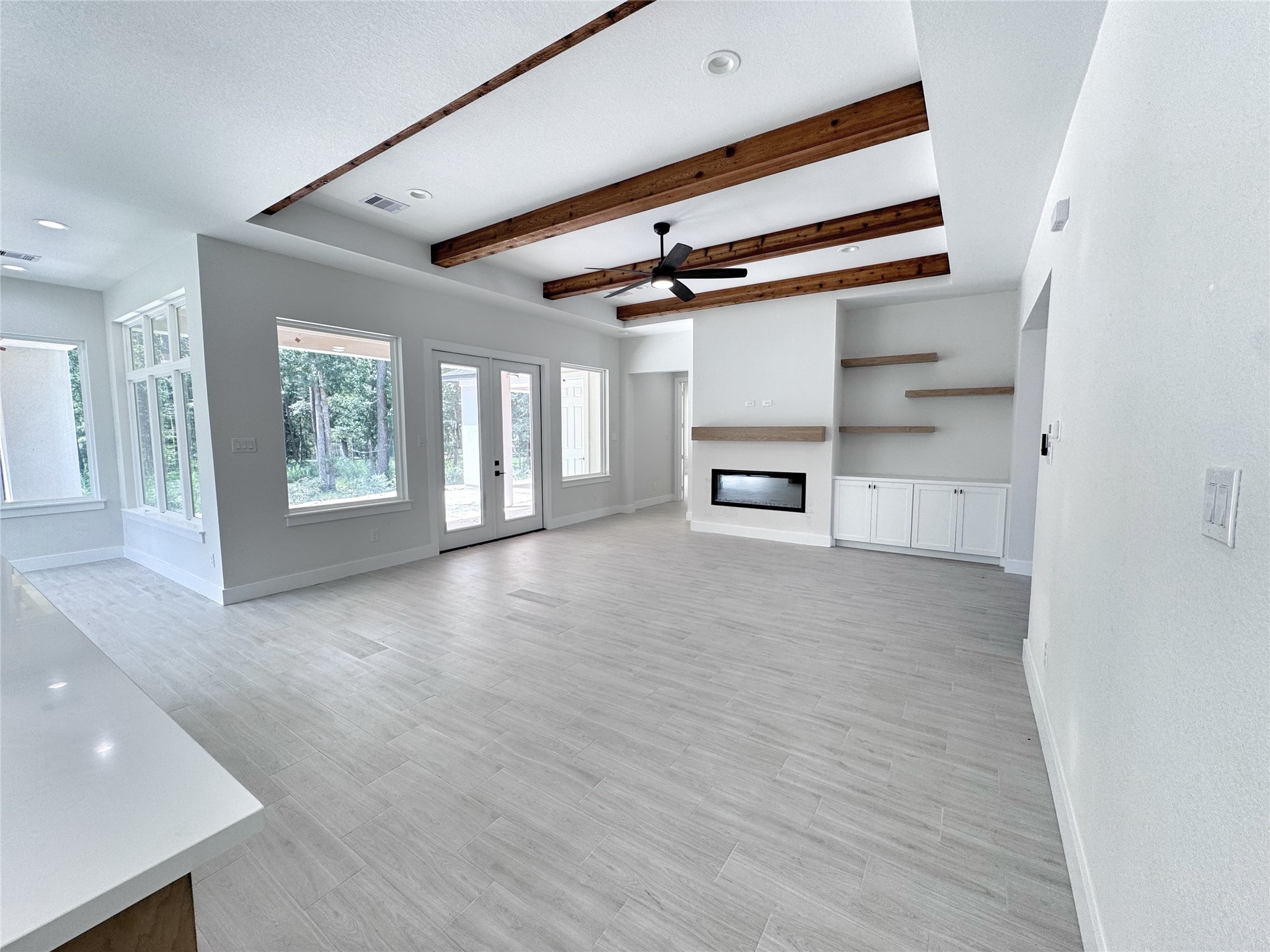 27710 Colapis Drive Splendora, TX 77372 - Photo 11 of 49 a view of a hallway with wooden floor and staircase