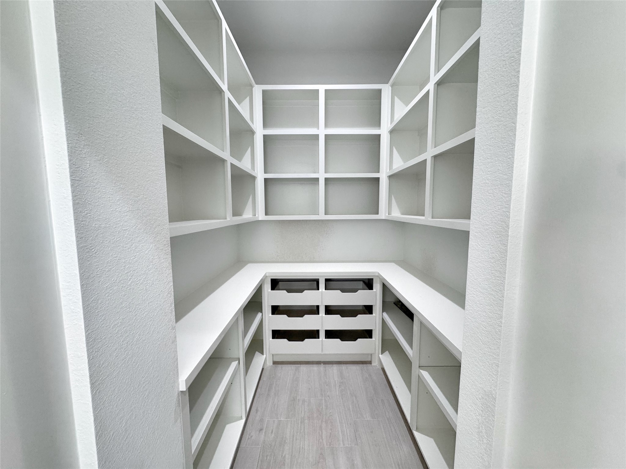 27710 Colapis Drive Splendora, TX 77372 - Photo 19 of 49 a view of a room with racks on the wall