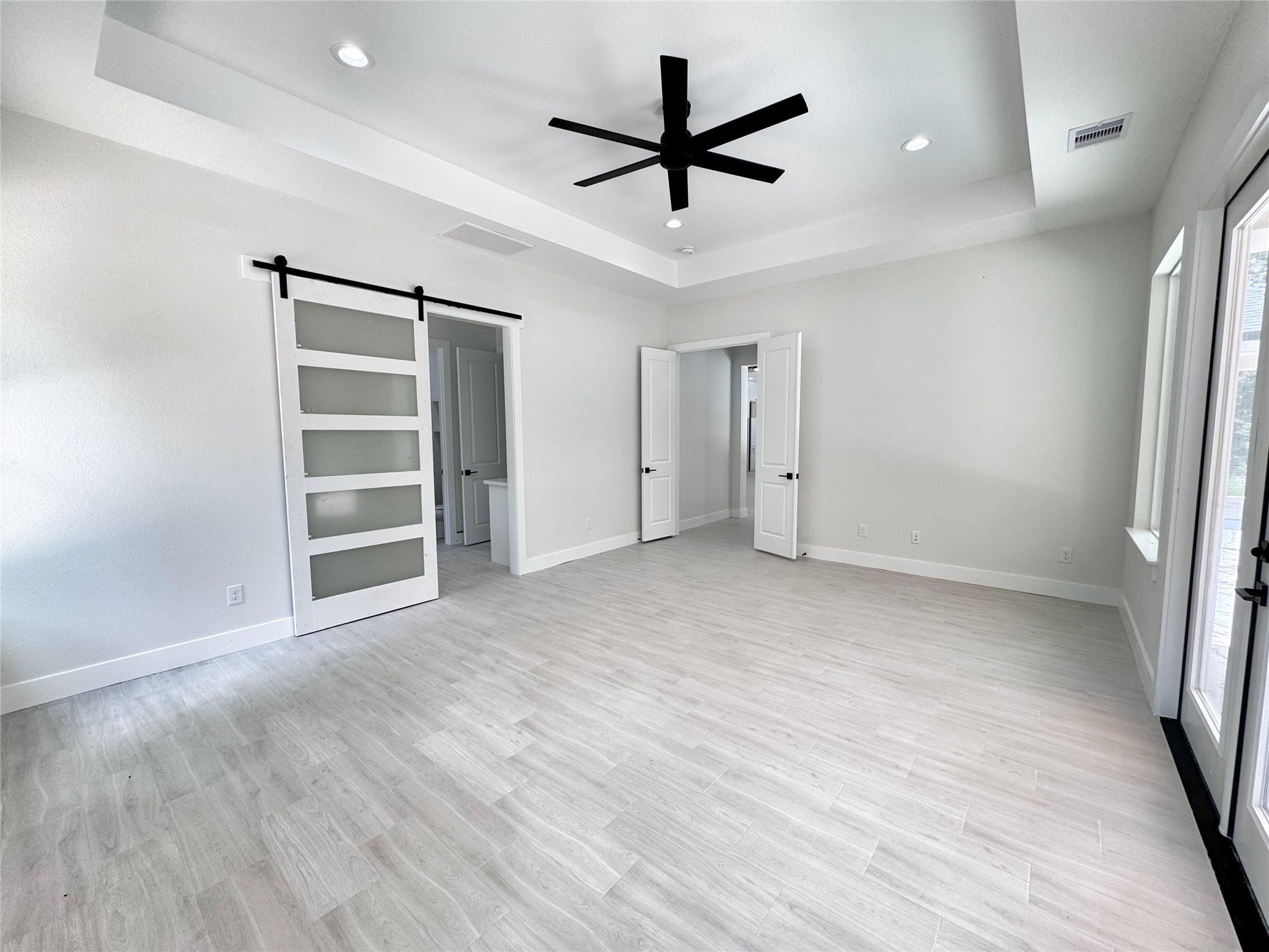 27710 Colapis Drive Splendora, TX 77372 - Photo 26 of 49 wooden floor in an empty room with a window