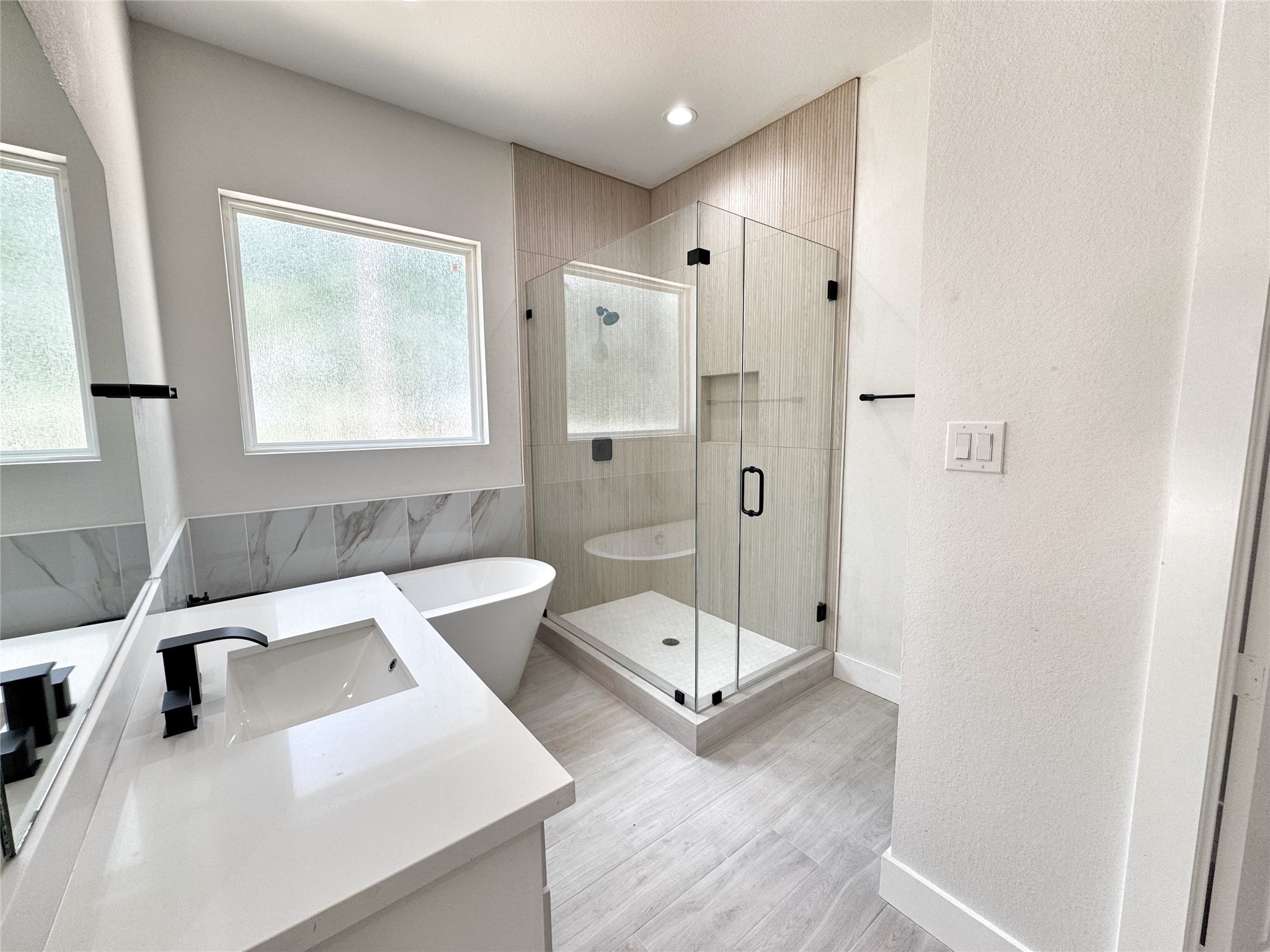 27710 Colapis Drive Splendora, TX 77372 - Photo 28 of 49 a bathroom with a tub toilet and sink