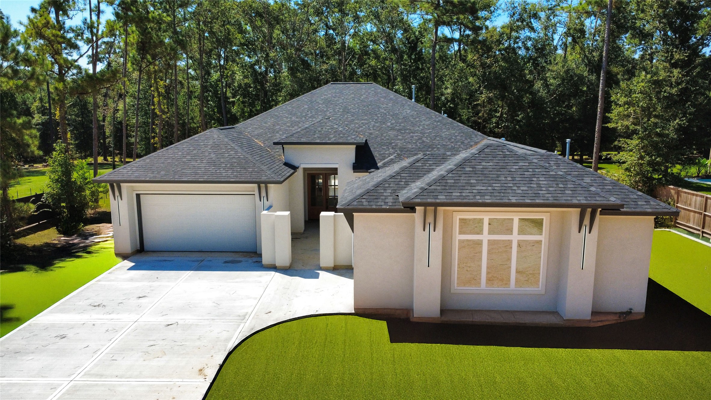 27710 Colapis Drive Splendora, TX 77372 - Photo 3 of 49 a front view of a house with a yard and garage