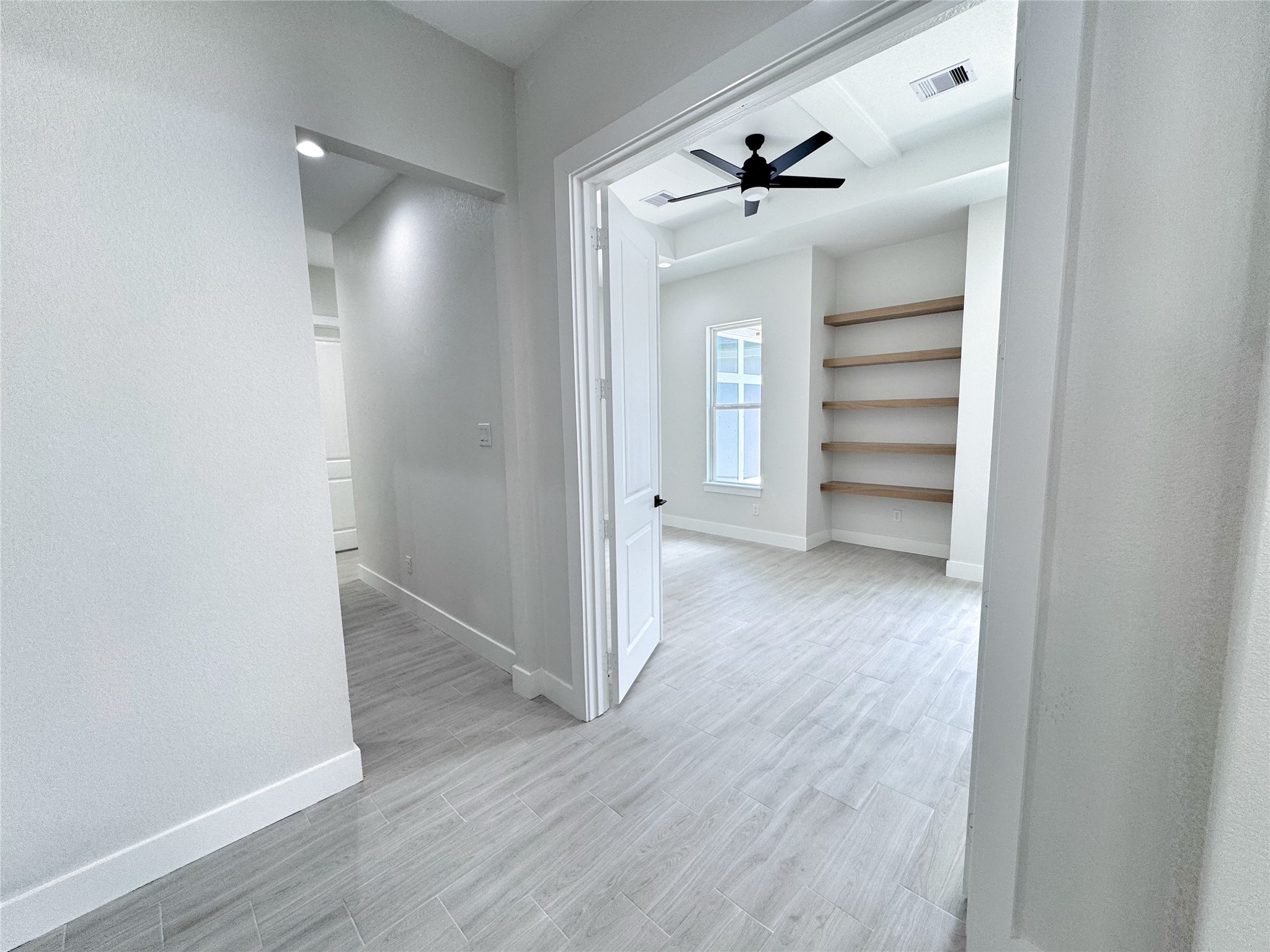 27710 Colapis Drive Splendora, TX 77372 - Photo 34 of 49 a view of a hallway with wooden floor and closet